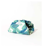 The Flat Lay Co. Open Flat Drawstring Makeup Bag in Tropical Leaves Print