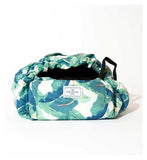The Flat Lay Co. Open Flat Drawstring Makeup Bag in Tropical Leaves Print